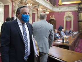 Quebec Premier Francois Legault arrive at a legislature committee studying his office budget spending, Wednesday, August 19, 2020 at the legislature in Quebec City.