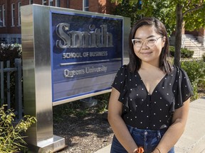 Fourth year Queen's University Commerce student Kelly Weiling Zou poses for a portrait outside Smith School of Business in Kingston, Ont., Friday, Aug. 14, 2020. Business school students in Ontario are sounding the alarm about what they call outright racism from fellow students and a lack of equity and diversity training among faculty. A number of social media accounts have popped up in recent months, anonymously recounting stories of racism happening in universities across the province.