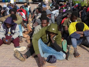 Migrants are seen after being intercepted by Libya's GNA iInterior Ministry before attempting a journey to Europe, at a security checkpoint in the city of Khoms, Libya May 30, 2020.