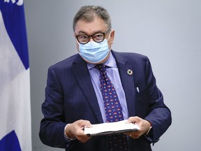 Dr. Horacio Arruda, Quebec's director of public health, arrives at a news conference in Montreal, on Friday, Aug. 7, 2020.