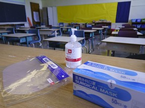 Personal protection equipment is seen on the teacher's desk in classroom in preparation for the new school year at the Willingdon Elementary School in Montreal, on Wednesday, August 26, 2020.
