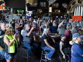 People watch a concert at the Full Throttle Saloon during the 80th Annual Sturgis Motorcycle Rally in Sturgis, South Dakota on Aug. 9, 2020.