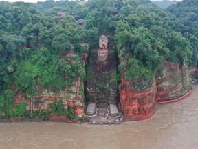 This aerial photo shows the Leshan Giant Buddha surrounded by floodwaters following heavy rains in Leshan in China's southwestern Sichuan province on August 19, 2020.