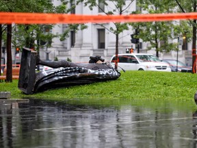 The statue of Sir John A. Macdonald lies in two pieces at the base of the monument from which it was pulled during demonstration by the Coalition for BIPOC Liberation in Montreal Saturday August 29, 2020.