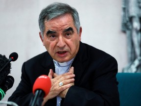 Cardinal Giovanni Angelo Becciu, who has been caught up in a real estate scandal, speaks to the media a day after he resigned suddenly and gave up his right to take part in an eventual conclave to elect a pope, near the Vatican, in Rome, Italy, September 25, 2020.