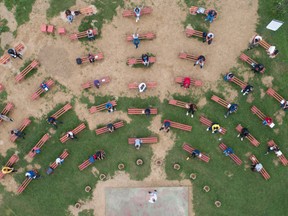 Students attend a class at an elementary school in an open-air classroom, before the start of the school year amid the coronavirus disease (COVID-19) outbreak, in Kacuni, Bosnia and Herzegovina, September 8, 2020.