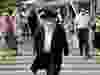 An ultra-Orthodox Jewish man wearing a protective mask and shield against the coronavirus, walks along a street in Jerusalem on September 11, 2020.