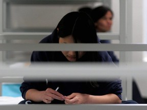 Female detainees rest on their bunks in Port Isabel detention facility in Los Fresnos, Texas. Human rights organizations on September 14, 2020 denounced the number of hysterectomies carried out at a migrant detention centre in the United States after one detainee described it as like "an experimental concentration camp."