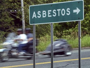 A sign directs the way to Asbestos, Quebec. Yves Legault said it would be easier attracting employers to his Quebec hometown if its name didn't make people think of cancer.