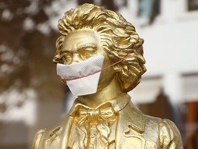 A bust of Ludwig van Beethoven is seen wearing a handmade face mask in the streets of Bonn, Germany, on April 8, 2020, during the coronavirus pandemic.