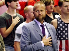 Brad Parscale, Trump 2020 re-election campaign manager, stands for the national anthem as U.S. President Donald Trump rallies with supporters during a Make America Great Again re-election campaign rally in Southaven, Mississippi, U.S., October 2, 2018.