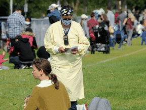 Hundreds of families with children wait in line at a COVID-19 testing centre in Ottawa, Wednesday, September 16, 2020. A spokeswoman for Ontario Health said the ministry is looking at allowing pharmacies to perform some COVID tests.