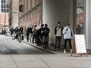 People line up outside a public clinic to get a COVID-19 test in Toronto on September 10. The very idea of private testing sites during the greatest public health crisis of our generation is unsettling to some.