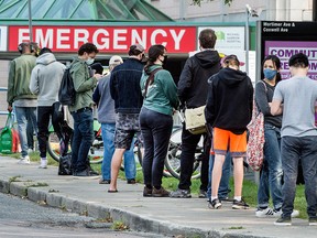 People lineup for COVID-19 testing outside of Toronto's Michael Garon Hospital on Sept. 15, 2020.