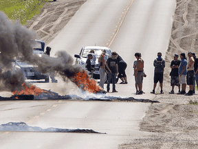 Indigenous protesters set fire to tires across a roadway in Caledonia, August 6, 2020.