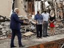U.S. President Donald Trump talks with local business people while examining property damage to a Kenosha business in the aftermath of recent protests against police brutality and racial injustice and ensuing violence after the shooting of Jacob Blake by a police officer in Kenosha, Wisconsin, September 1, 2020.