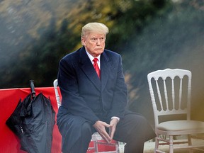 U.S. President Donald Trump attends the American Commemoration Ceremony at the Suresnes American Cemetery in Paris, France, on Sunday, Nov. 11, 2018, a day after drawing criticism for canceling a trip to a separate cemetery during centenary commemorations of the end of World War I.