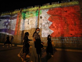 The flags of Israel, United Arab Emirates and Bahrain are projected on the ramparts of Jerusalem's Old City on Sept. 15, 2020, in a show of support for Israeli normalization deals with the United Arab Emirates and Bahrain.
