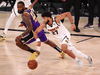 Los Angeles Lakers forward LeBron James chases Denver Nuggets guard Jamal Murray and the ball during the NBA Western Conference Finals, September 26, 2020.