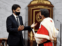 Prime Minister Justin Trudeau speaks with Chief Justice Richard Wagner as they wait for the throne speech in the Senate chamber on September 23, 2020.