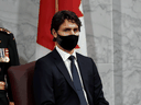 Prime Minister Justin Trudeau listens to Governor General Julie Payette delivering the throne speech in the Senate chamber on September 23, 2020.