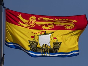 New Brunswick's provincial flag flies on a flag pole in Ottawa, Monday, July 6, 2020.