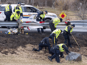 RCMP investigators search for evidence at the location where Const. Heidi Stevenson was killed along the highway in Shubenacadie, N.S.