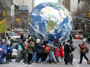 New York protestors have the whole world in their hands in We Are Many.