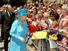 Queen Elizabeth II and Prince Philip, Duke of Edinburgh talk to well-wishers after attending the Sunday service at the St James Cathedral Church on July 4, 2010 in Toronto.