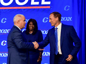 Newly elected Conservative leader Erin O'Toole, left, greets his fellow candidates Peter MacKay and Leslyn Lewis after his victory speech, in Ottawa, August 24, 2020.