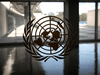 The United Nations logo on a window in an empty hallway at United Nations headquarters during the 75th annual UN General Assembly high-level debate, which is being held mostly virtually due to the COVID-19 pandemic, New York, September 21, 2020.