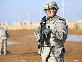 In this file photo a US soldier stands at the Taji base complex which hosts Iraqi and US troops and is located thirty kilometres north of the capital Baghdad on December 29, 2014.