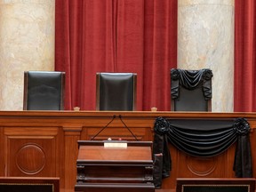The late Justice Ruth Bader Ginsburg's bench at the Supreme Court stands draped with black bunting in Washington.