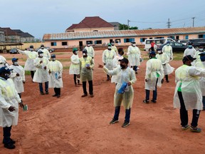 The General Manager of the Lagos State Environmental Protection Agency (LASEPA) Dolapo Fasawe (C) addresses staff upon arrival to a formative session for agents training leaders of various unions who are scheduled to train members on measures to curb the spread of COVID-19 coronavirus ahead of the expected gradual easing of the lockdown from next week at Odoguyan in Ikorodu district of Lagos, on April 30, 2020.