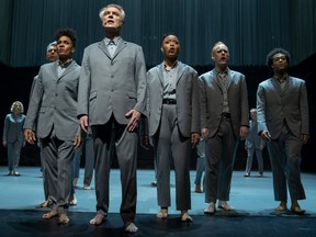 At front, David Byrne leads his performers in American Utopia.