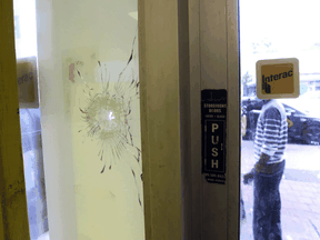 A bullet hole near the entrance to Spence's Bakery in Toronto after what police say was an drive-by shooting on Wednesday September 2, 2020.