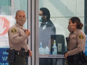 Los Angeles County Sheriffs Department (LASD) deputies stand outside St. Francis Medical Center hospital following the ambush shooting of two deputies in Compton, in Lynwood, California, U.S., September 13, 2020.