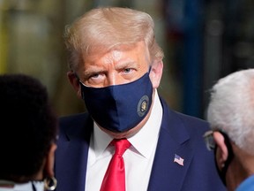 U.S. President Donald Trump wears a protective face mask due to the coronavirus disease