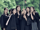 Graduates at Guangxi University pose for a selfie. The institute's much criticized dress code warns female students to avoid creating temptation.
