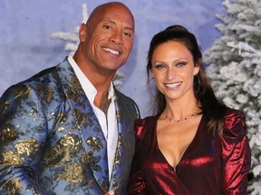 In this file photo taken on December 9, 2019 US actor Dwayne Johnson and his wife singer Lauren Hashian arrive for the World Premiere of "Jumanji: The Next Level" at the TCL Chinese theatre in Hollywood
