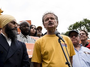 John Cartwright, President of the Toronto & York Region Labour Council, speaks before NDP Leader Jagmeet Singh makes an announcement in Toronto on Monday, Sept. 2, 2019. Union activists who for decades have marched through the streets of Canadian cities on Labour Day to celebrate workers' rights will commemorate the event differently this year as the COVID-19 pandemic continues to put the brakes on mass gatherings.