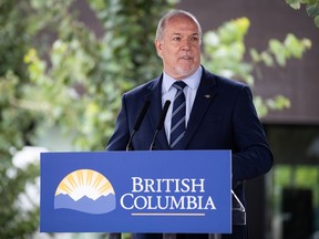 British Columbia Premier John Horgan speaks during an announcement about a new regional cancer centre, in Surrey, B.C., Thursday, Aug. 6, 2020. Horgan says in a statement that while the majority of people are following rules to stop the spread of COVID-19, a small number are ignoring orders.