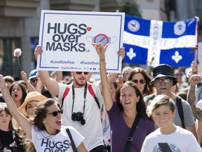 People take part in a demonstration opposing the mandatory wearing of face masks in Montreal, Saturday, September 12, 2020, as the COVID-19 pandemic continues in Canada and around the world.