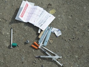 Needles are seen on the ground in Oppenheimer park in Vancouver's downtown eastside on March 17, 2020.