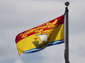 New Brunswick's provincial flag flies on a flag pole in Ottawa, Tuesday June 30, 2020. New Brunswick party leaders are preparing for another debate as they head into the final stretch of the provincial election campaign.