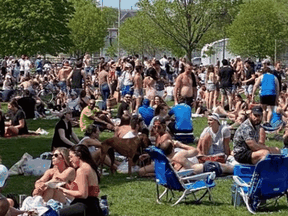 A large crowd gather at Toronto's Trinity Bellwoods Park on May 23, 2020.