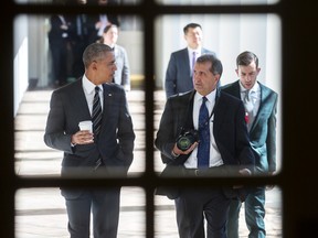 Focused: President Barack Obama chats with chief White House photographer Pete Souza.