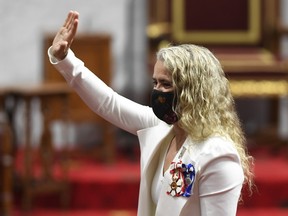 Governor General Julie Payette gives a wave as she waits before delivering the throne speech in the Senate chamber in Ottawa on Sept. 23, 2020.