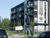 Police investigators walk past a condo building related to an investigation into the ricin-filled envelope sent to the White House, as an RCMP team checks the area in Longueuil, Quebec, September 21, 2020.