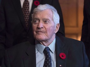 Former prime minister John Turner looks on during a photo op to mark the 150th anniversary of the first meeting of the first Parliament of Canada, in Ottawa on Monday, Nov. 6, 2017. Turner, dubbed "Canada's Kennedy" when he first arrived in Ottawa in the 1960s, has died at the age of 91.